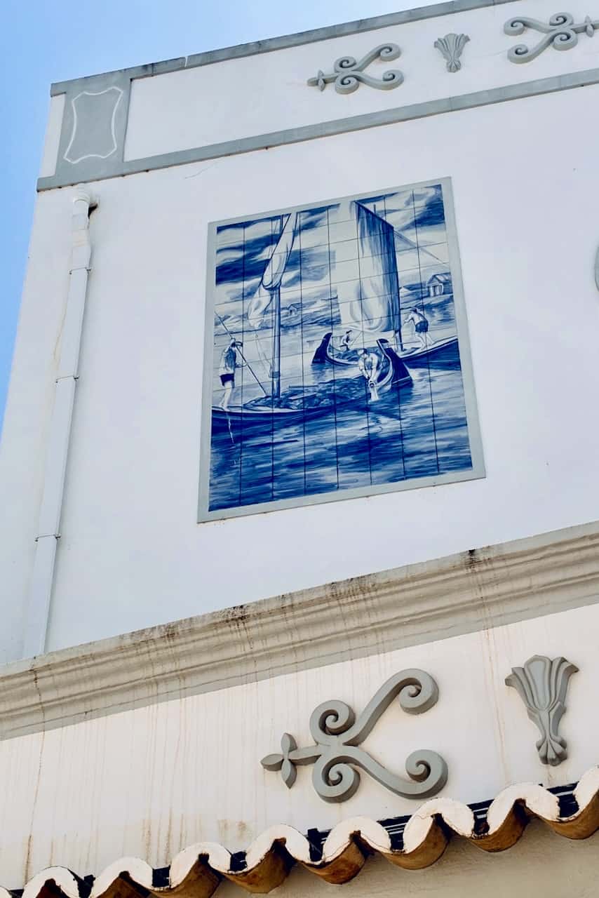 Original blue and white tile panel depicting a fishing boat in Olhão, Portugal